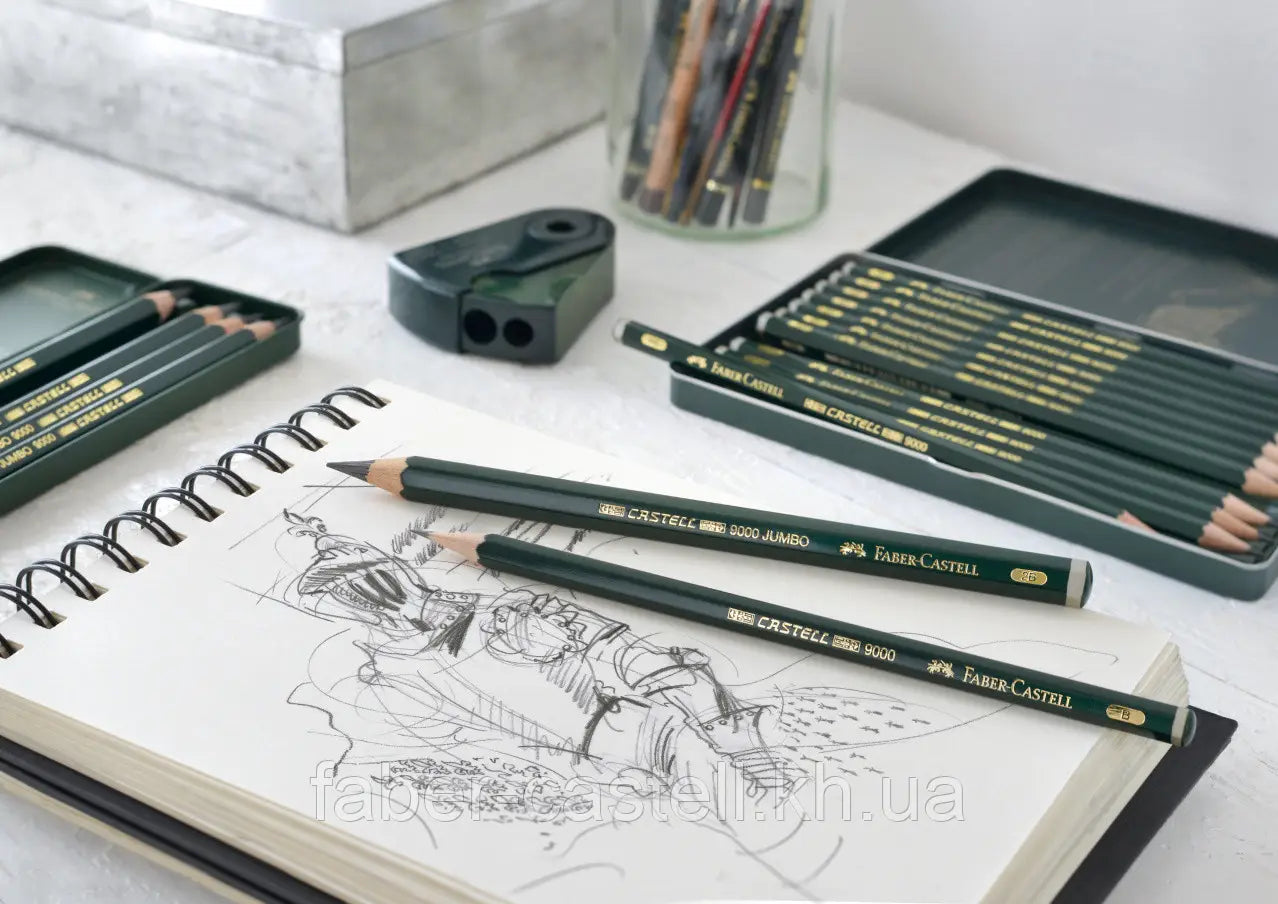 Faber-Castell blyanter på en blok med billede af en person